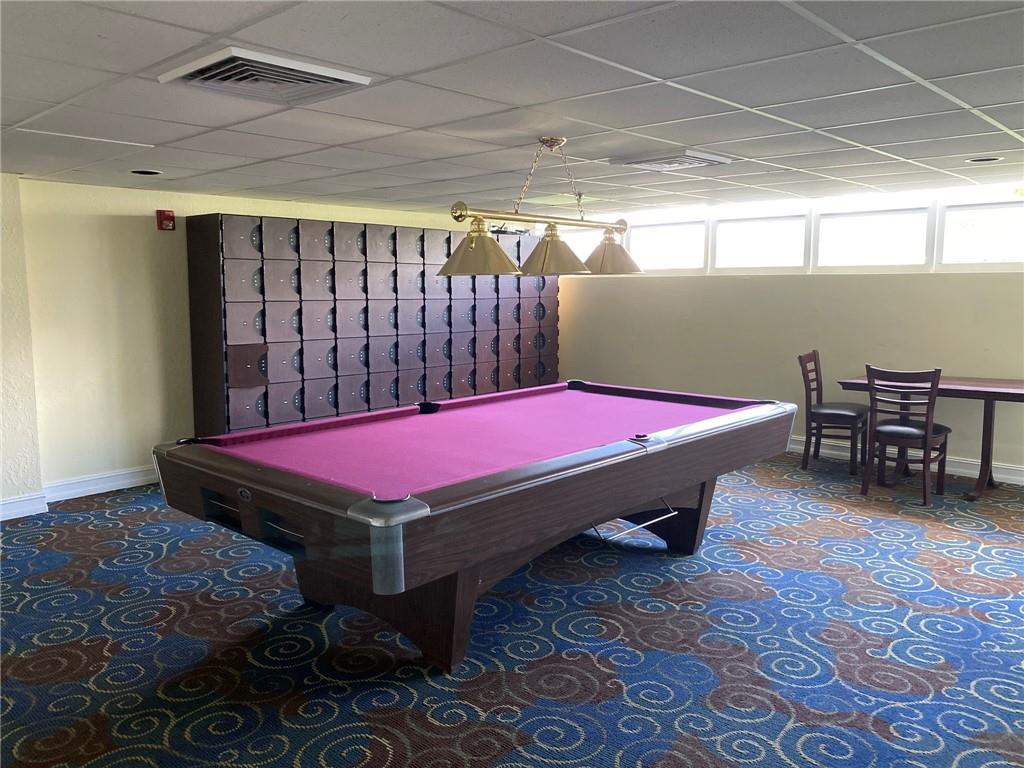 1010 South Ocean Boulevard, Unit PH12 Pompano Beach, FL 33062 - Photo 41 of 47 a room with pool table and windows