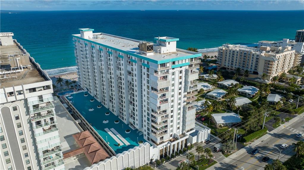 1010 South Ocean Boulevard, Unit PH12 Pompano Beach, FL 33062 - Photo 47 of 47 a balcony with table and chairs