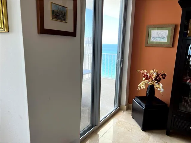 a view of a balcony with chair and table