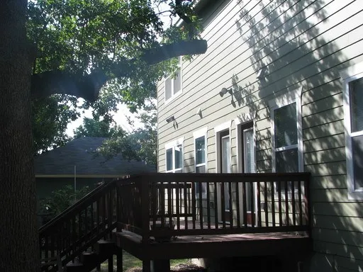 a view of a brick house with a large window