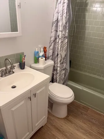 a bathroom with a sink and shower