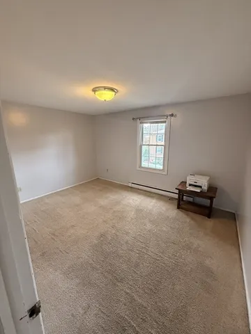 a bedroom with a bed and the shower