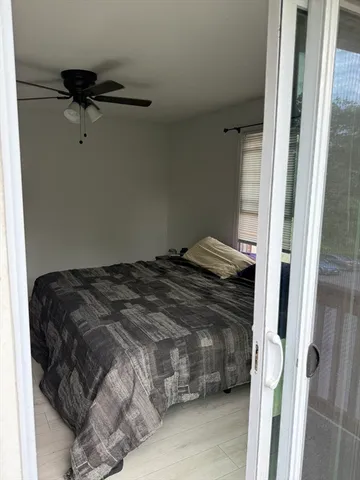 a view of a balcony with wooden floor