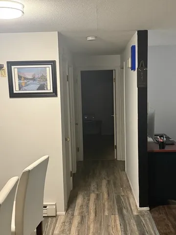 a view of a living room and hardwood floor