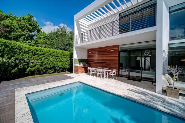 a view of a swimming pool with a patio