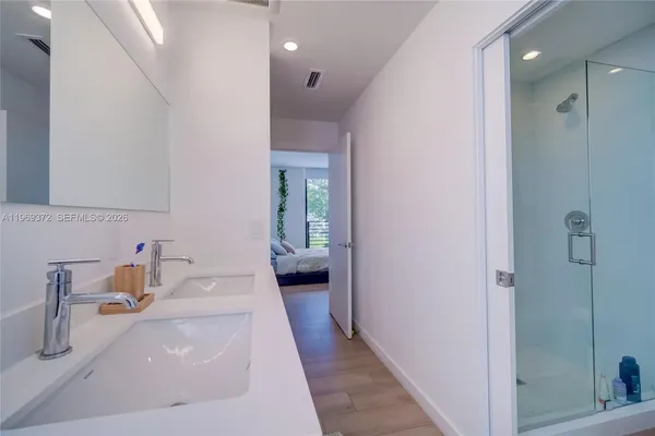 a view of a hallway with wooden shelves