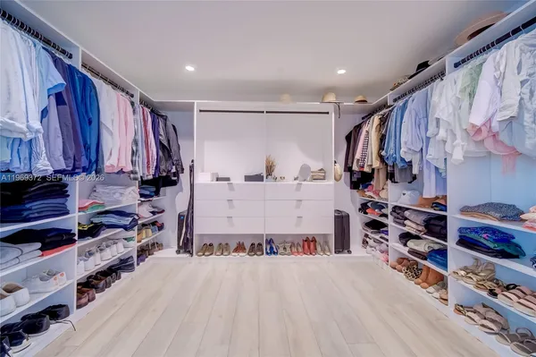 a very nice looking room with a large window and chandelier