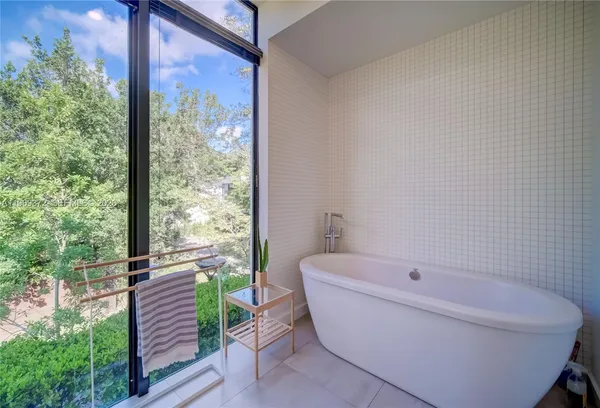 an entryway and livingroom with furniture