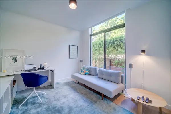 a kitchen with stainless steel appliances a sink and a refrigerator