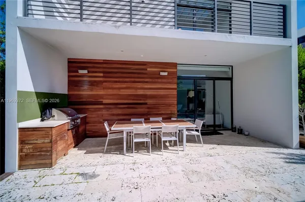 a swimming pool with outdoor seating and yard