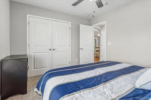 a bedroom with two beds and a table