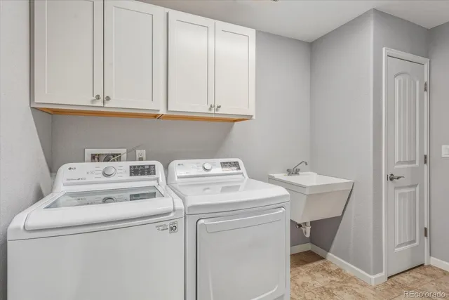 a living room with furniture and a gym equipment