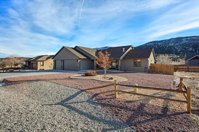 a living room with furniture a rug and a table