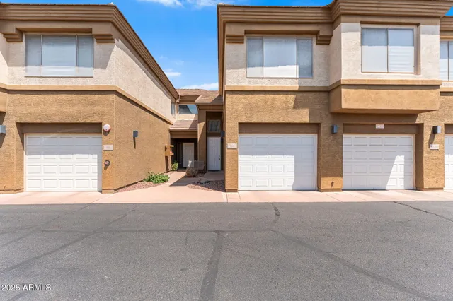 a front view of a house with a garage