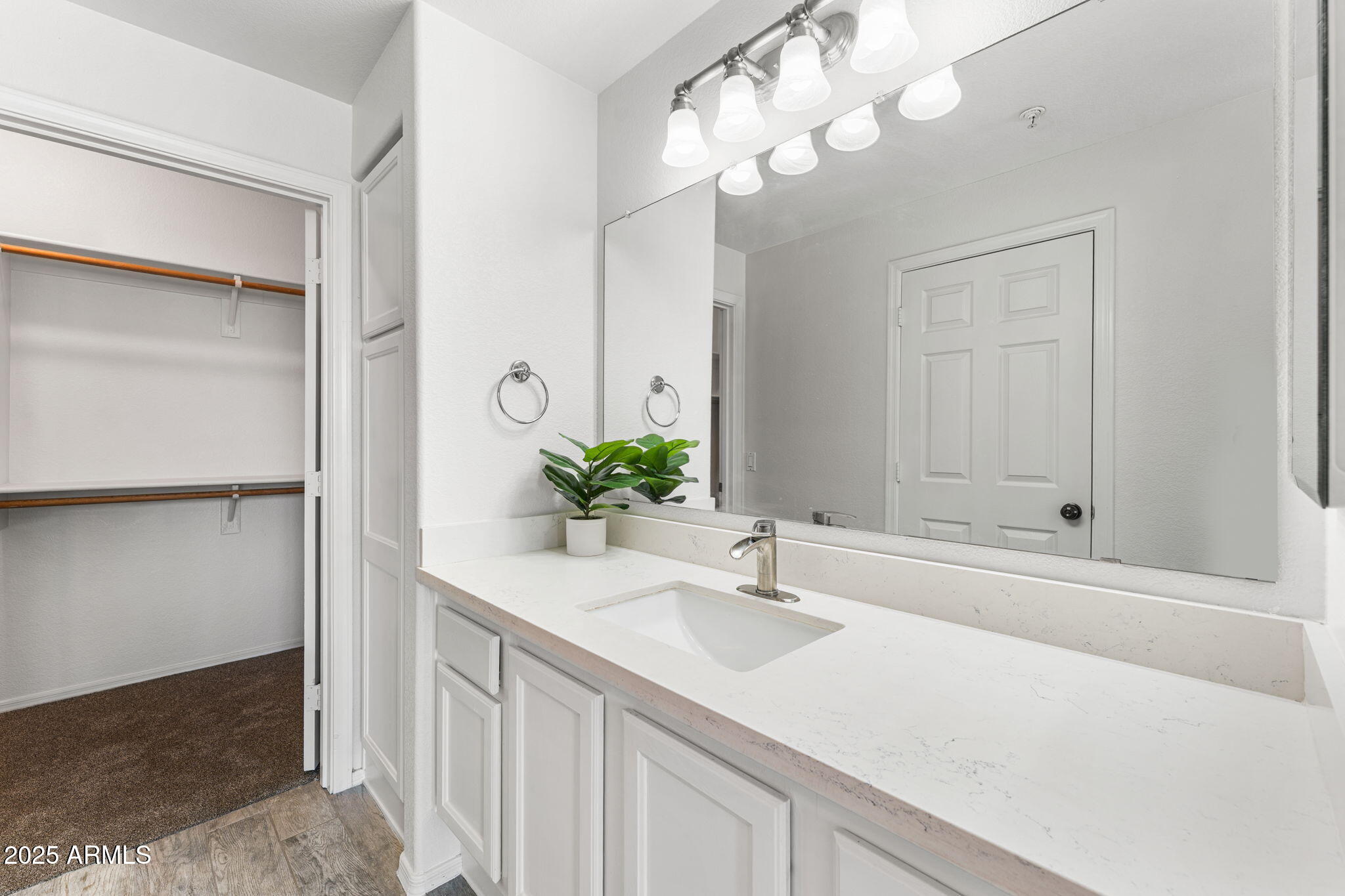 1445 East Broadway Road, Unit 208 Tempe, AZ 85282 - Photo 12 of 18 a bathroom with a sink a vanity and a mirror
