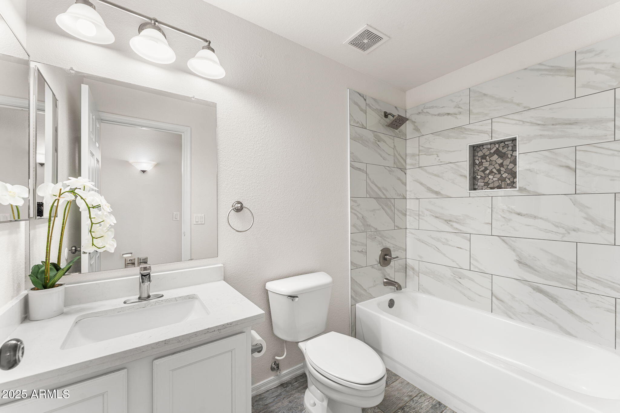 1445 East Broadway Road, Unit 208 Tempe, AZ 85282 - Photo 13 of 18 a bathroom with a sink a toilet and shower