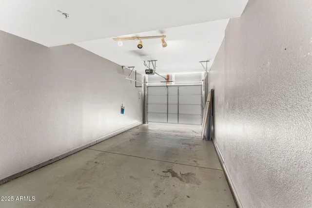 a front view of a house with a parking area