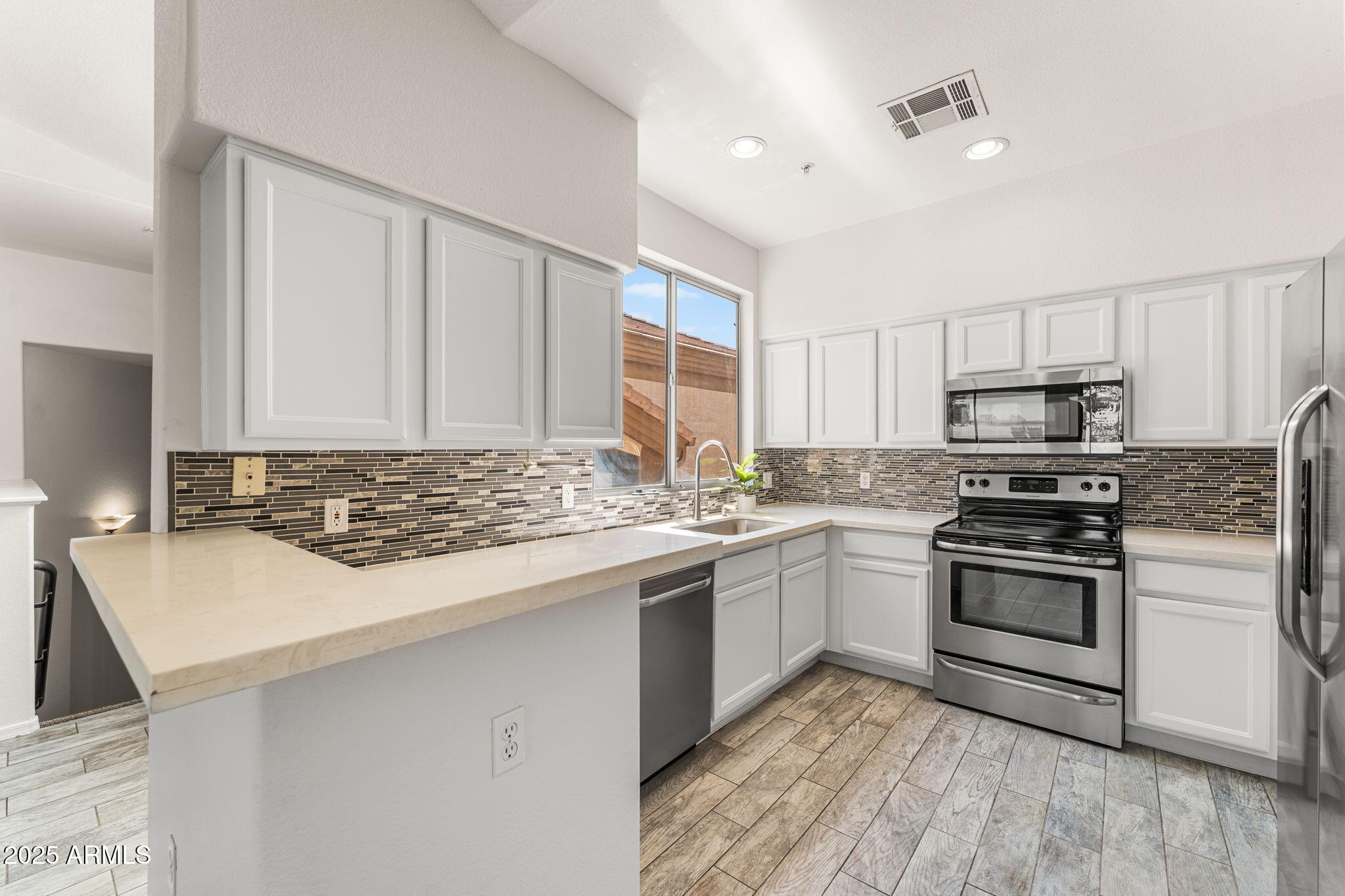 1445 East Broadway Road, Unit 208 Tempe, AZ 85282 - Photo 6 of 18 a kitchen with a sink stove and cabinets