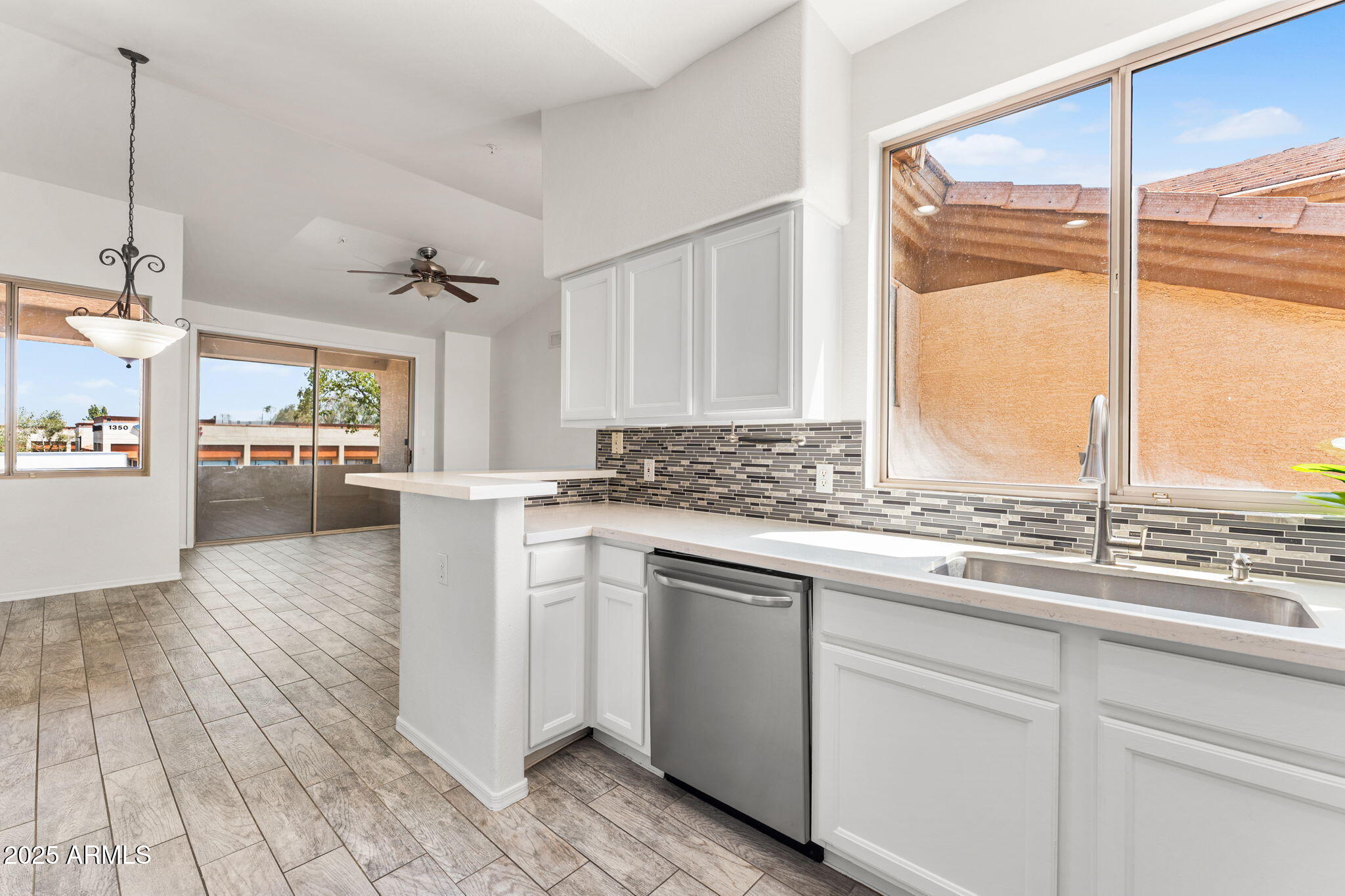1445 East Broadway Road, Unit 208 Tempe, AZ 85282 - Photo 8 of 18 a kitchen with a sink cabinets and window