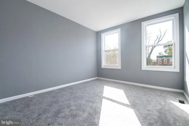 a view of an empty room and window