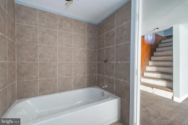 a view of a wooden door of the house