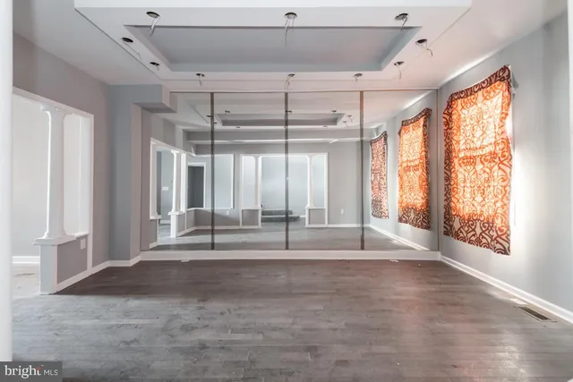 a view of a livingroom with a ceiling fan and window
