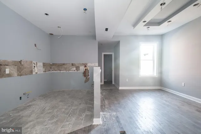 a view of storage and utility room with a window
