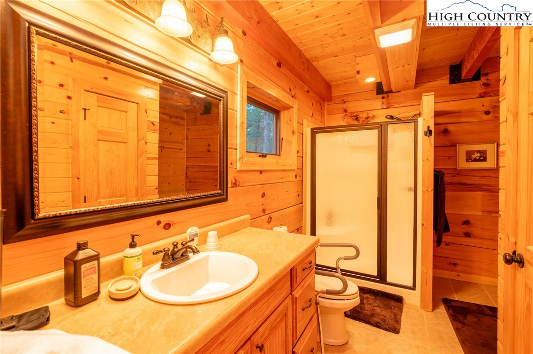 160 Capote Court Boone, NC 28607 - Photo 15 of 45 a bathroom with a sink and a mirror