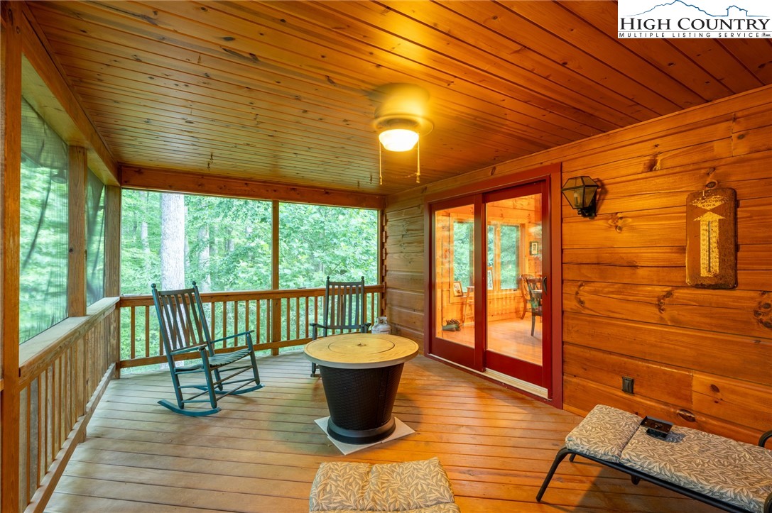 160 Capote Court Boone, NC 28607 - Photo 24 of 45 a view of a patio with a dining table and chairs