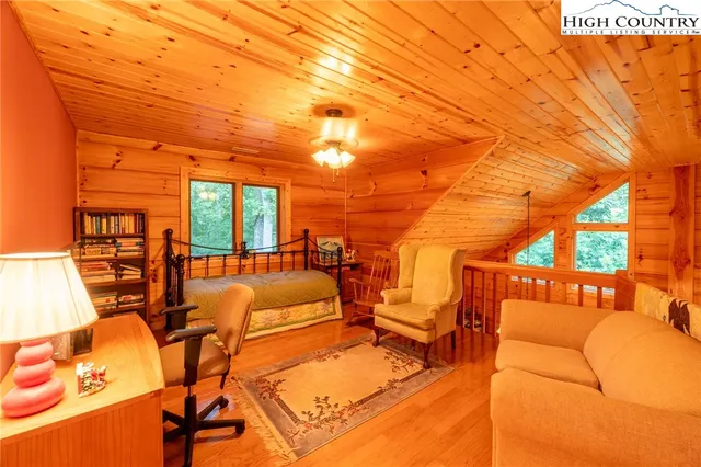 a bed room with a bed and a night stand