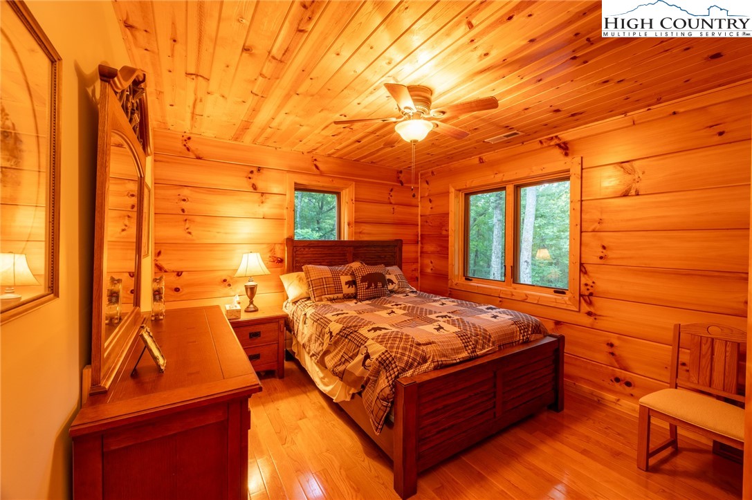 160 Capote Court Boone, NC 28607 - Photo 29 of 45 a bed room with a bed and a night stand