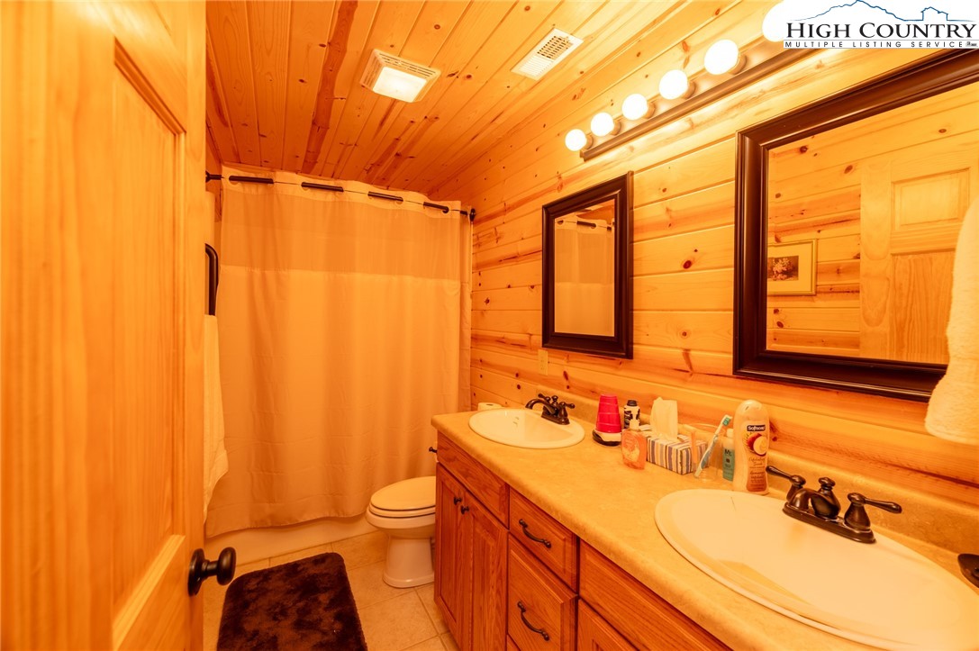 160 Capote Court Boone, NC 28607 - Photo 30 of 45 a bathroom with a sink and a mirror