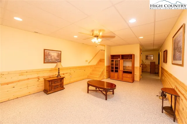 a bathroom with a sink mirror vanity shower and toilet