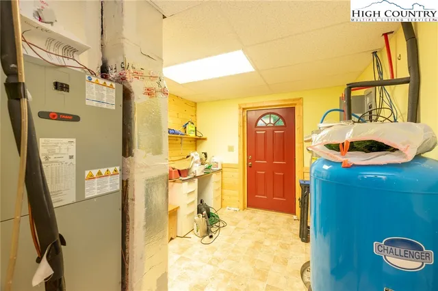 a view of a house with a small deck