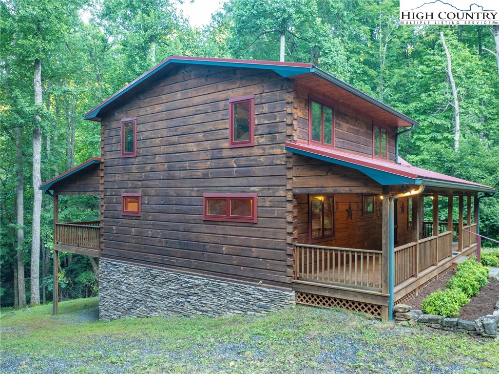 160 Capote Court Boone, NC 28607 - Photo 39 of 45 a front view of a house with a garden