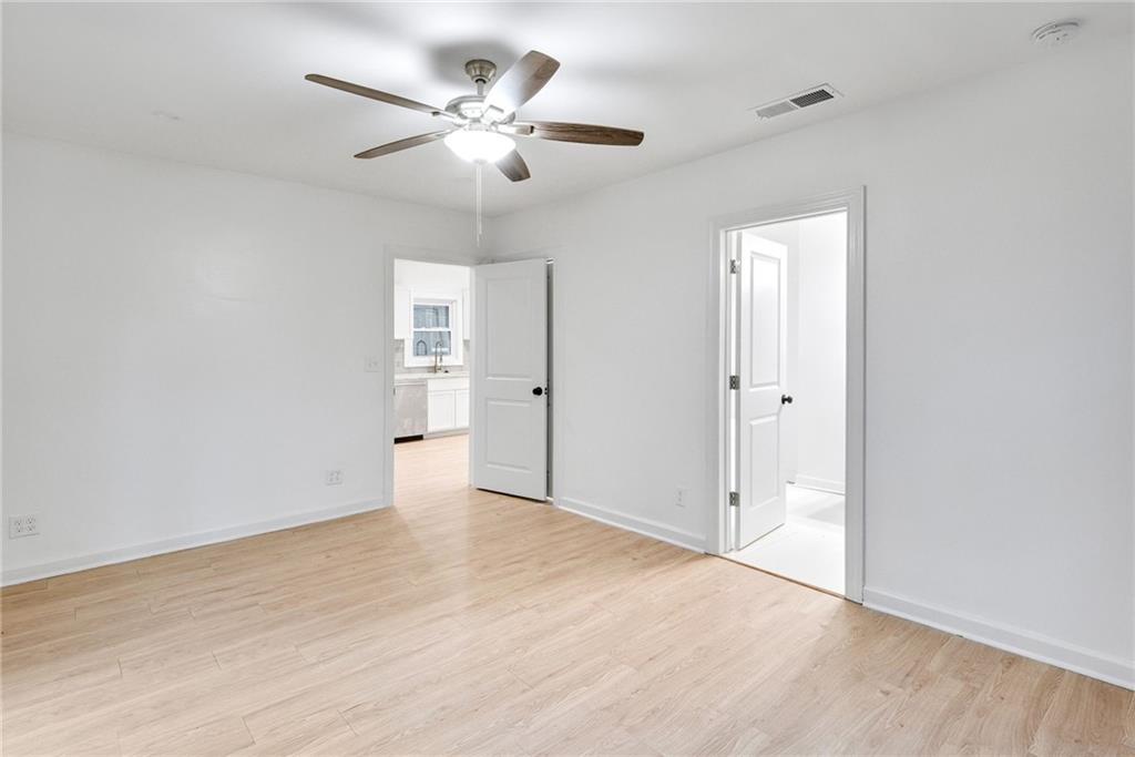 1967 Browns Mill Road Southeast Atlanta, GA 30315 - Photo 16 of 35 an empty room with fan and a ceiling fan
