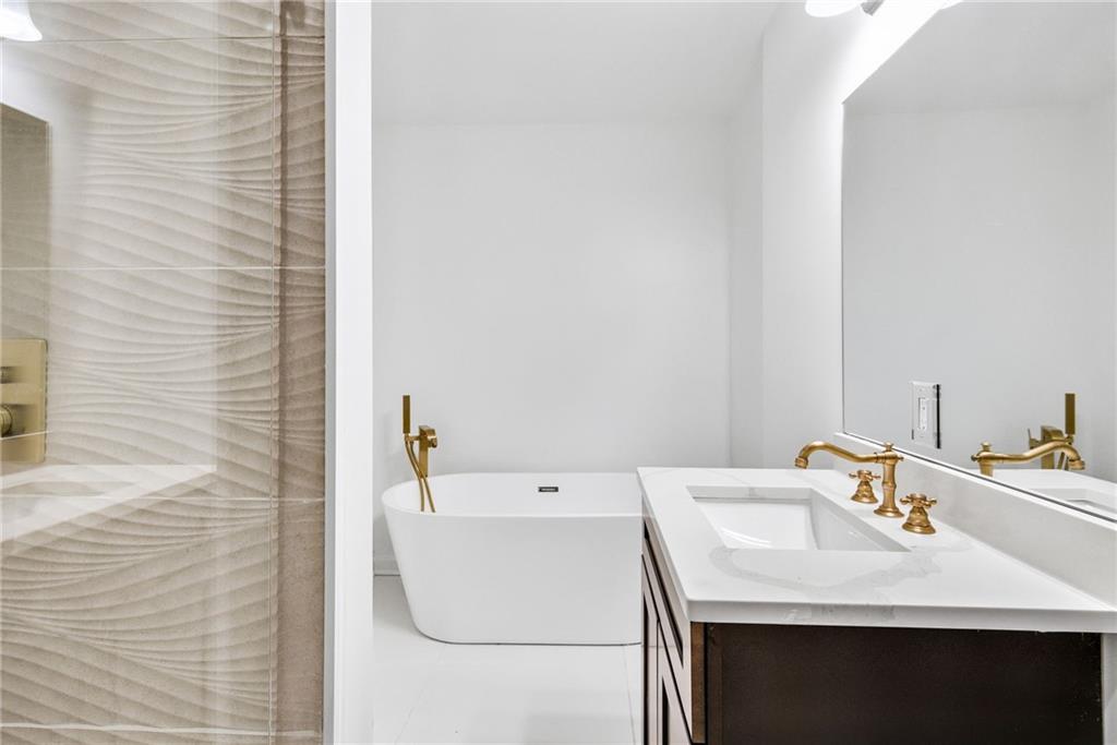 1967 Browns Mill Road Southeast Atlanta, GA 30315 - Photo 19 of 35 a bathroom with a sink and a mirror