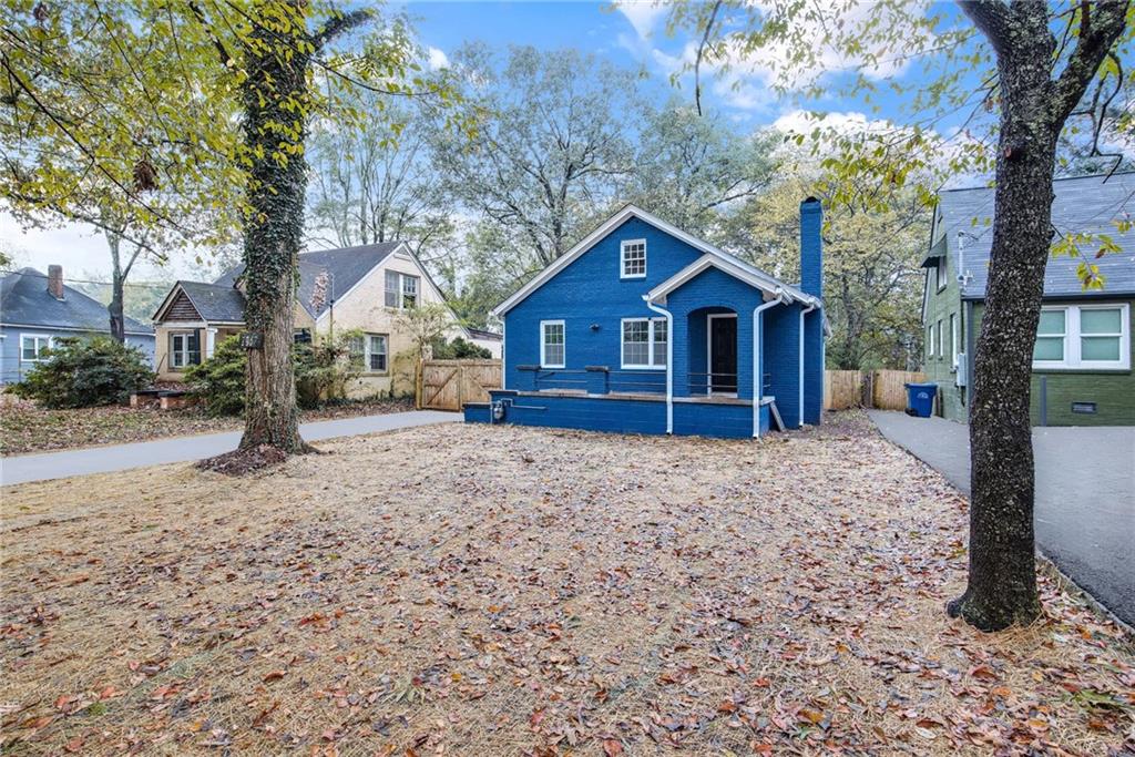 1967 Browns Mill Road Southeast Atlanta, GA 30315 - Photo 2 of 35 a front view of a house with a yard covered in snow