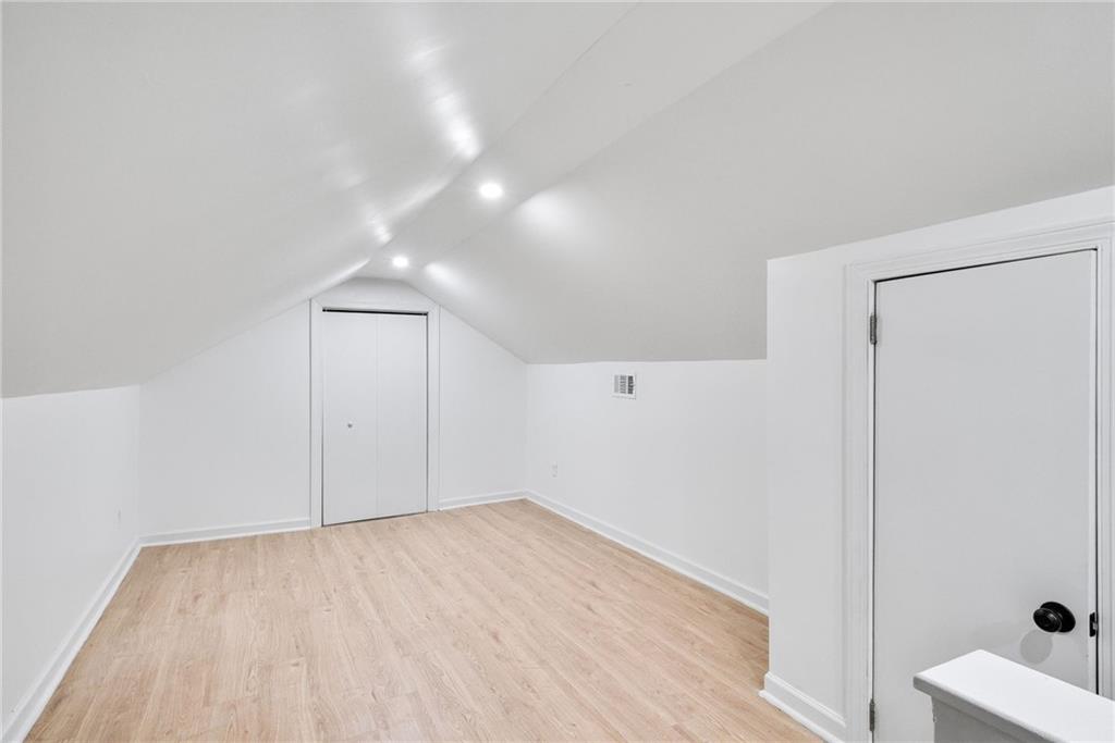 1967 Browns Mill Road Southeast Atlanta, GA 30315 - Photo 25 of 35 a view of empty room with wooden floor