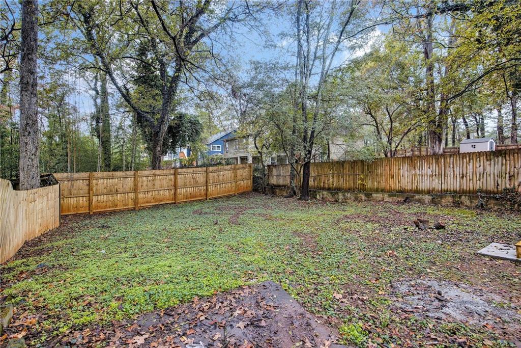 1967 Browns Mill Road Southeast Atlanta, GA 30315 - Photo 31 of 35 a view of backyard with trees