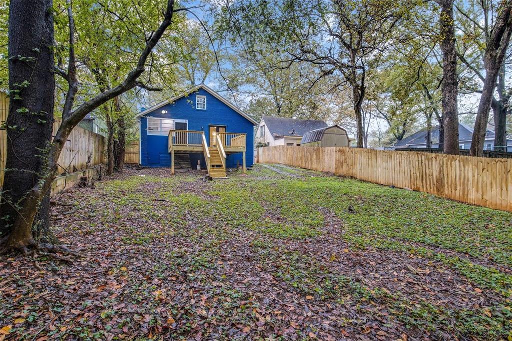 1967 Browns Mill Road Southeast Atlanta, GA 30315 - Photo 34 of 35 a wooden house with a yard