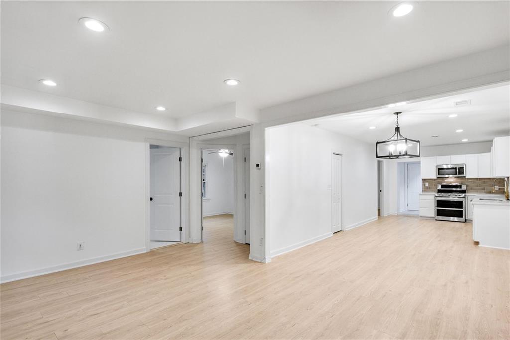 1967 Browns Mill Road Southeast Atlanta, GA 30315 - Photo 5 of 35 a view of a kitchen with a sink and a refrigerator