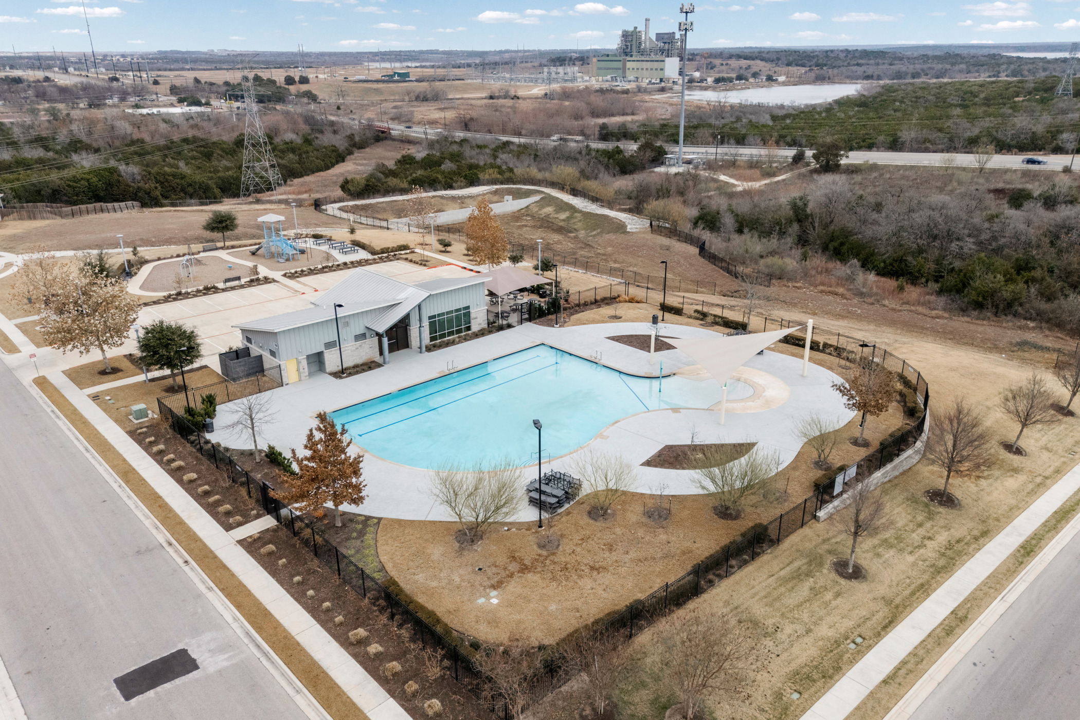 8324 Mimi Lane Austin, TX 78724 - Photo 40 of 40 Another view of the amenity center, featuring a pool, playground, covered pavilion, and clubhouse
