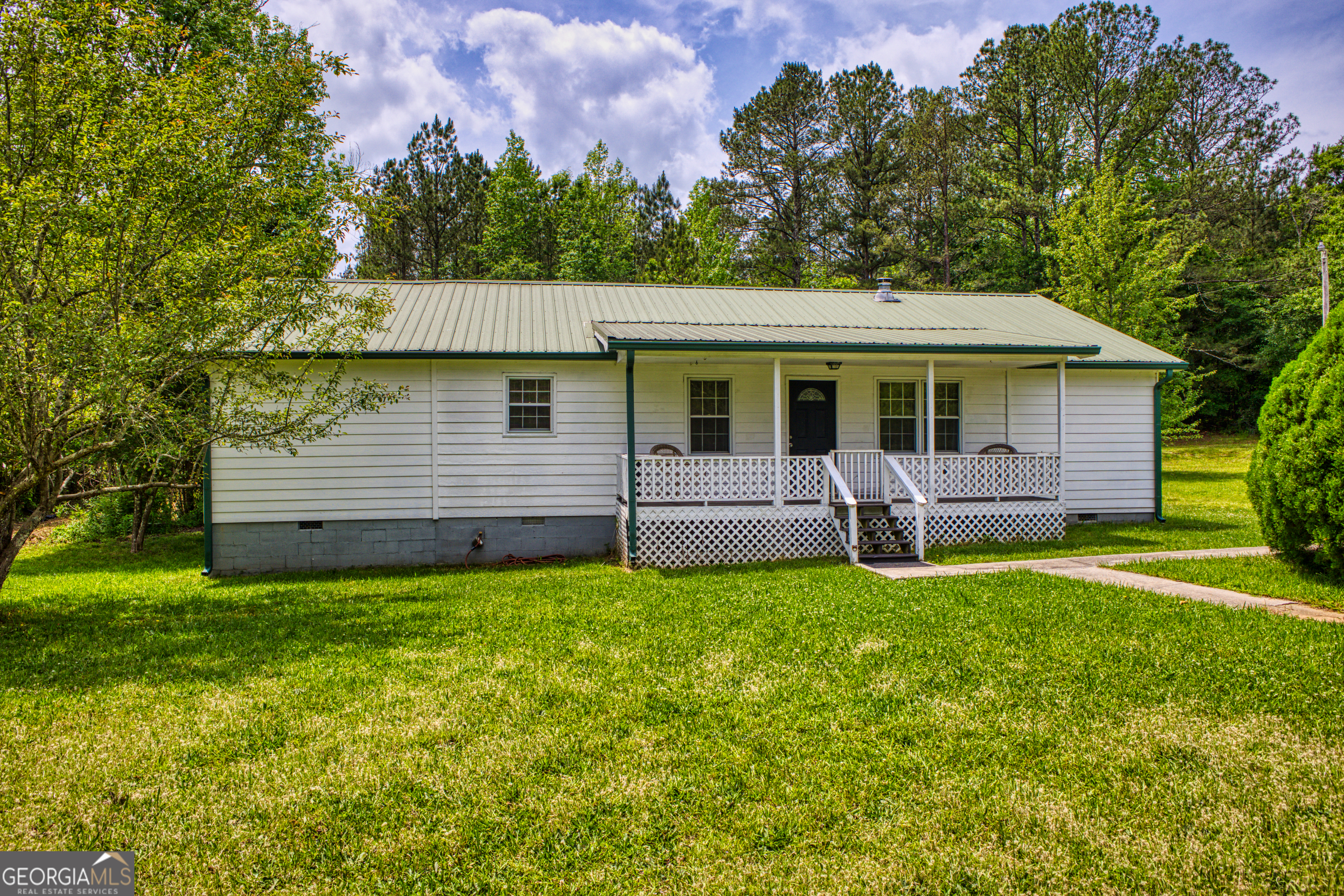 3175 South Van Wert Road Villa Rica, GA 30180 - Photo 1 of 1 a view of a house with a backyard