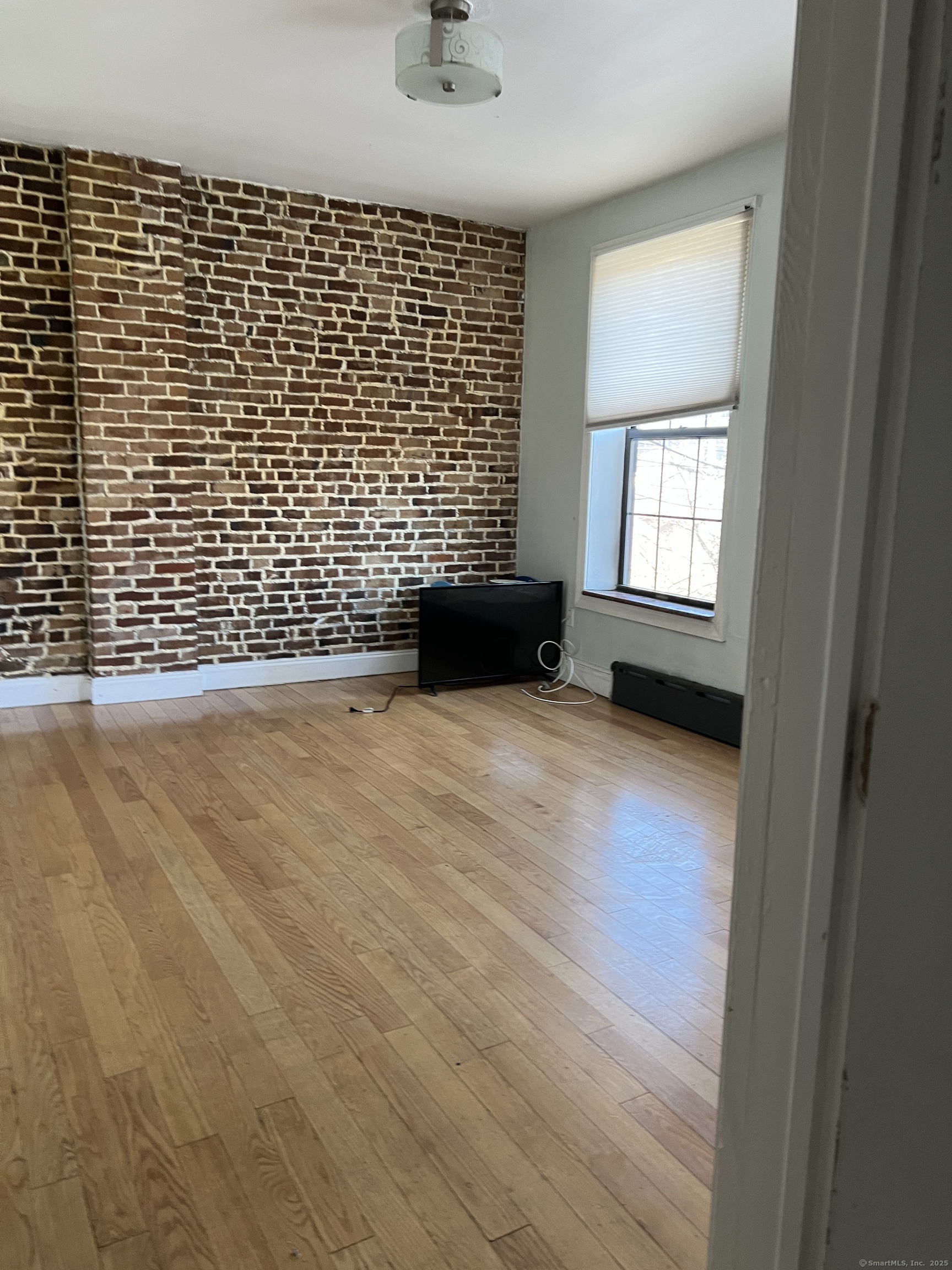 546 Congress Avenue, Unit 1 New Haven, CT 06519 - Photo 5 of 14 a view of an empty room with a window