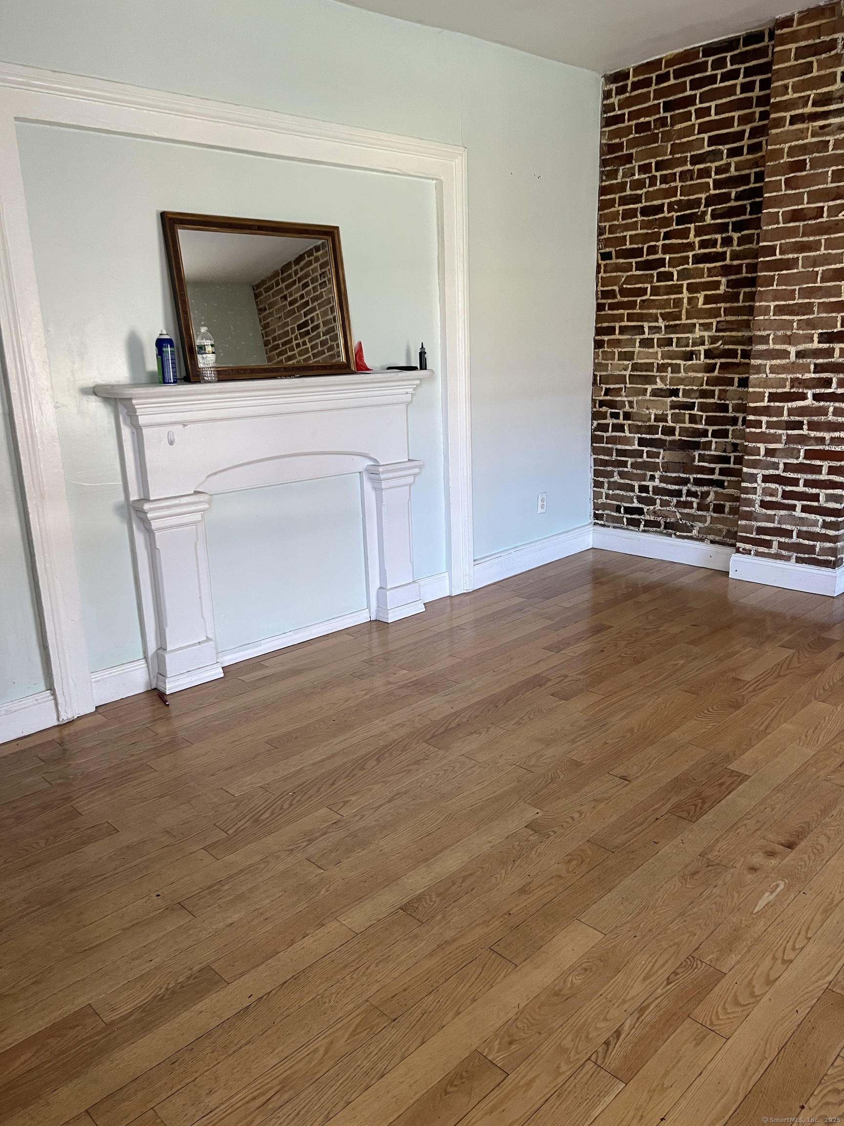 546 Congress Avenue, Unit 1 New Haven, CT 06519 - Photo 6 of 14 a view of an empty room and wooden floor