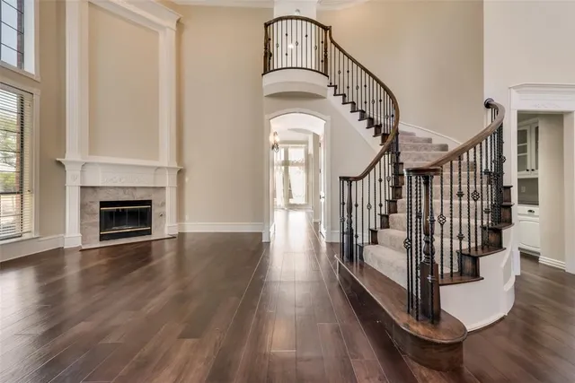a view of entryway and hall with wooden floor