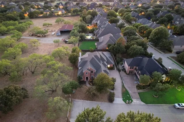 an aerial view of lake residential house with swimming pool and outdoor space