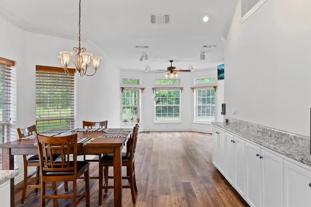 a view of a dining room with furniture window and outside view