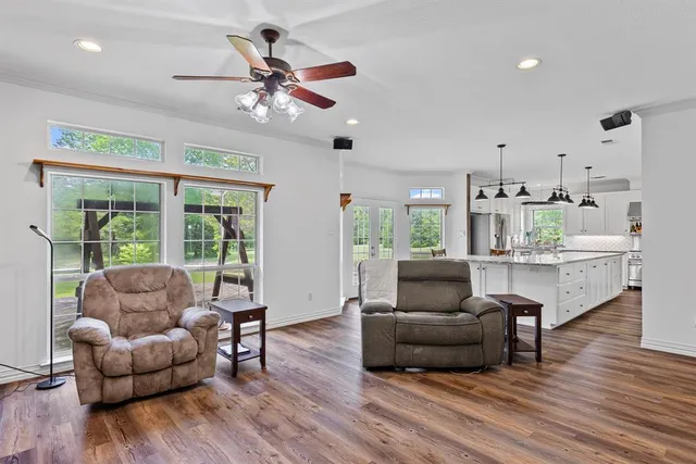 a living room with furniture and a large window